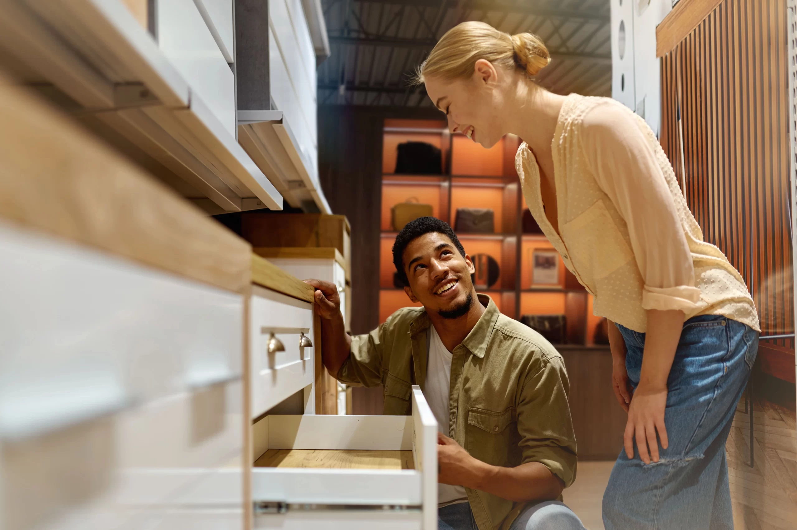 interracial-couple-choosing-new-cabinets-kitchen-furniture-store-looking-details