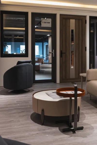 Modern showroom interior with contemporary doors, windows, and designer furniture display