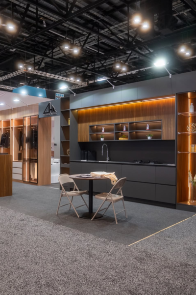 Modern custom closet showroom display with illuminated wooden cabinetry