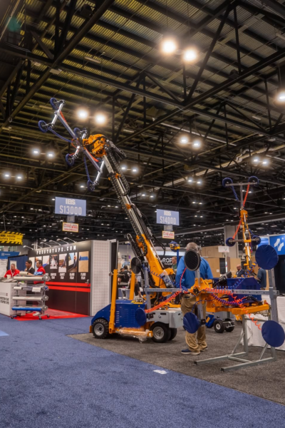Industrial glass installation equipment displayed at construction trade show